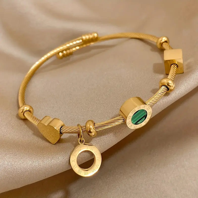 Rhian – Bracelete dourado de assinatura