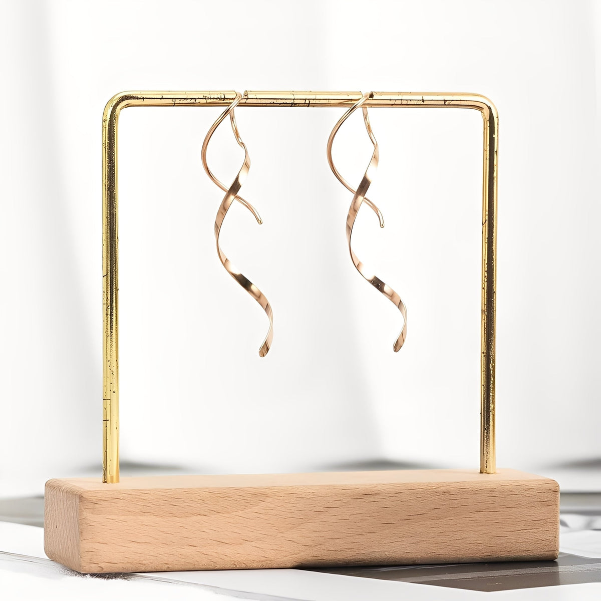 Mel – Brincos espirais em ouro