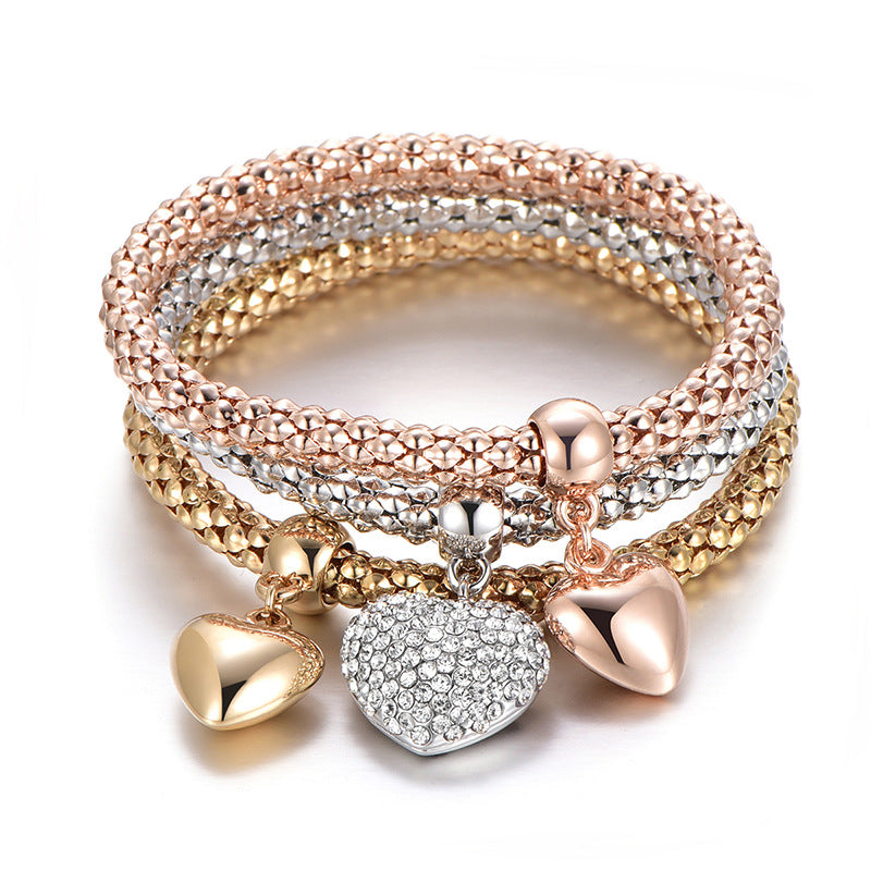 Aria – Bracelete em metal com corações sólidos