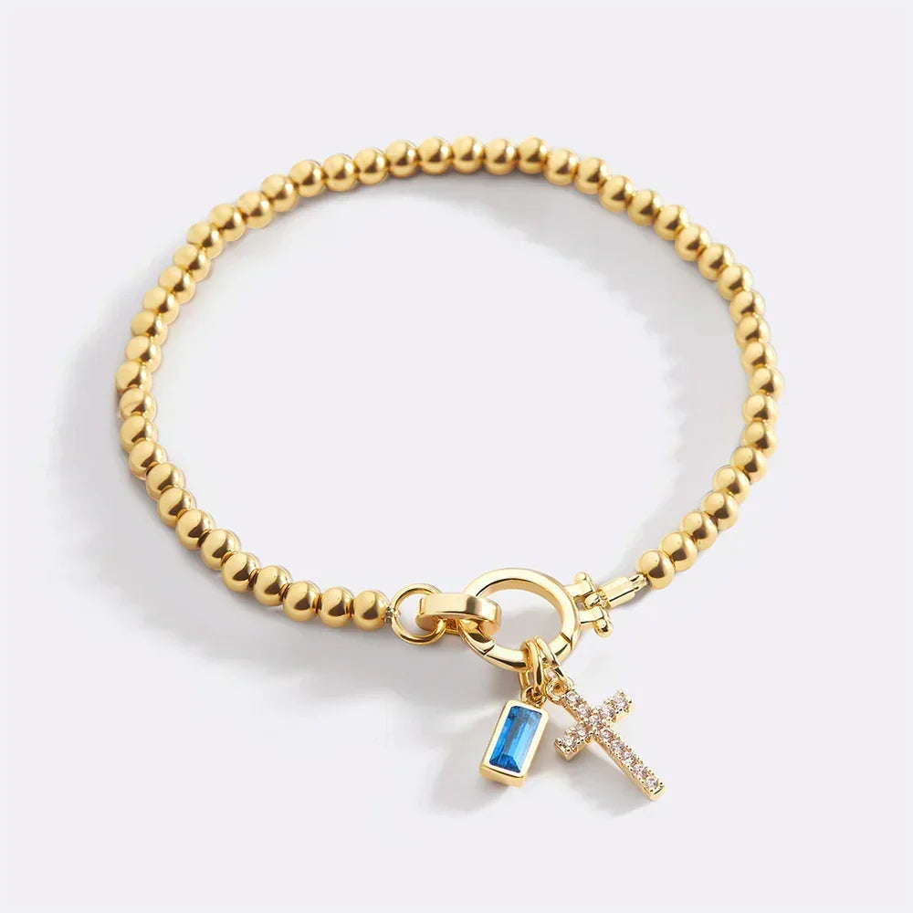 Eli – Pulseira com pedra do mês de nascimento e pendente de cruz