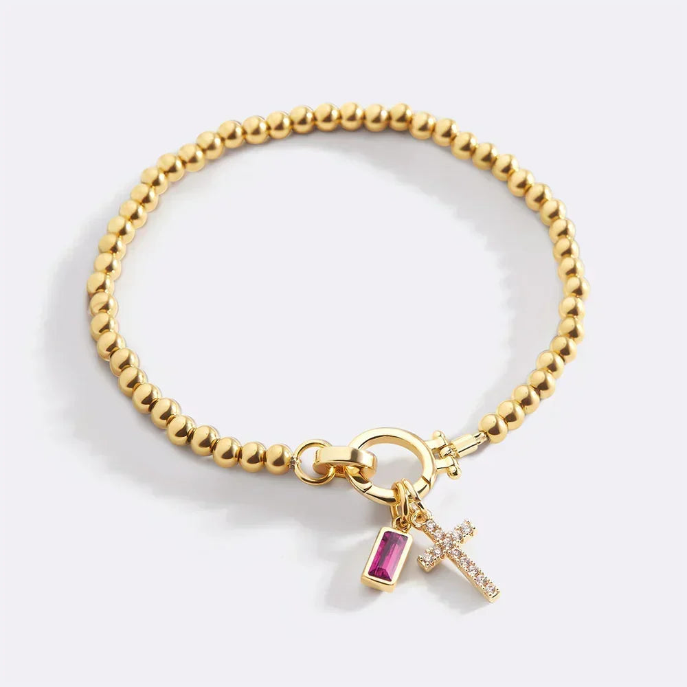 Eli – Pulseira com pedra do mês de nascimento e pendente de cruz