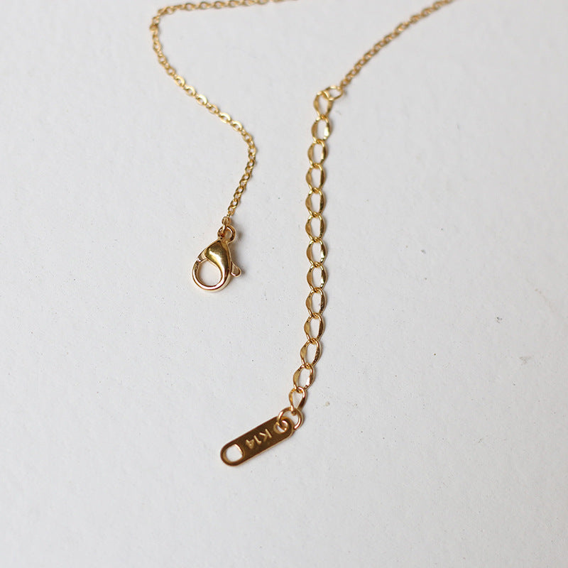 Nelly – Colar cruz minimalista em ouro