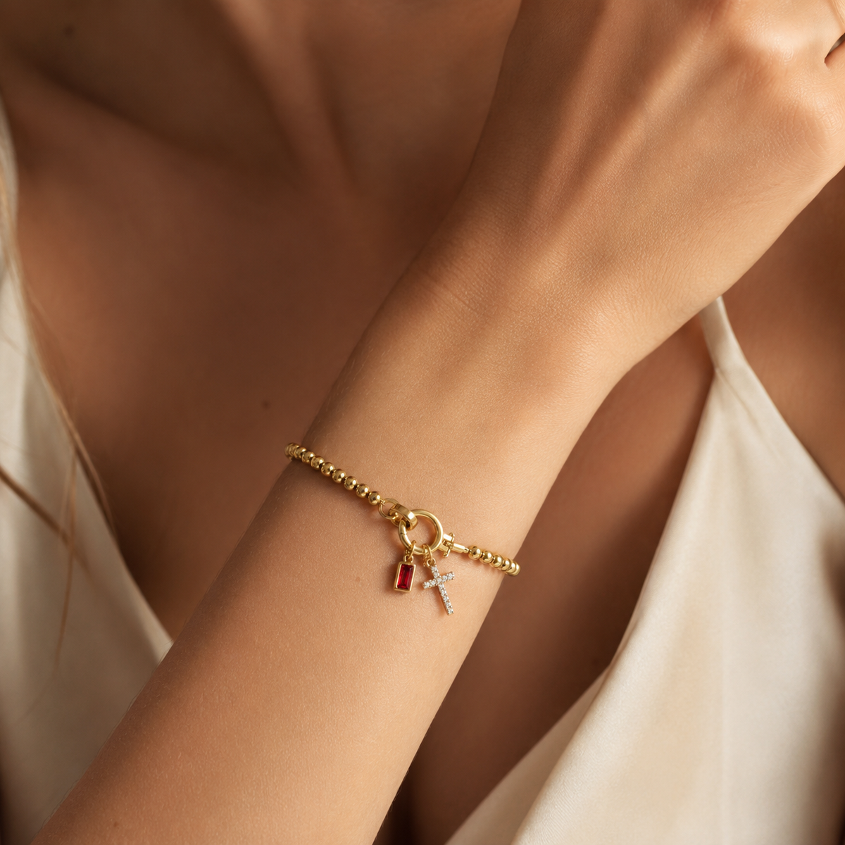 Eli – Pulseira com pedra do mês de nascimento e pendente de cruz