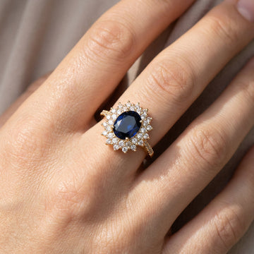Delphine – Bague Chic dourada com pedra azul