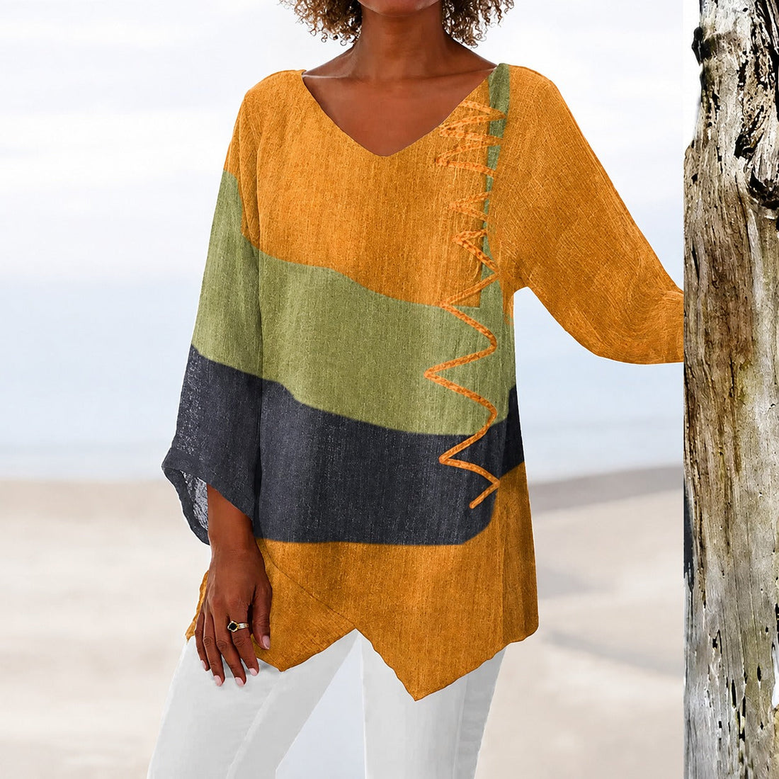 Eli - Blusa colorida que cobre a barriga