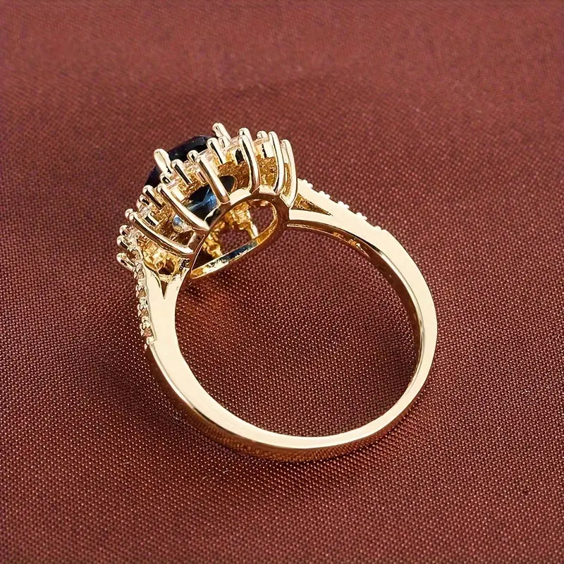 Delphine – Bague Chic dourada com pedra azul