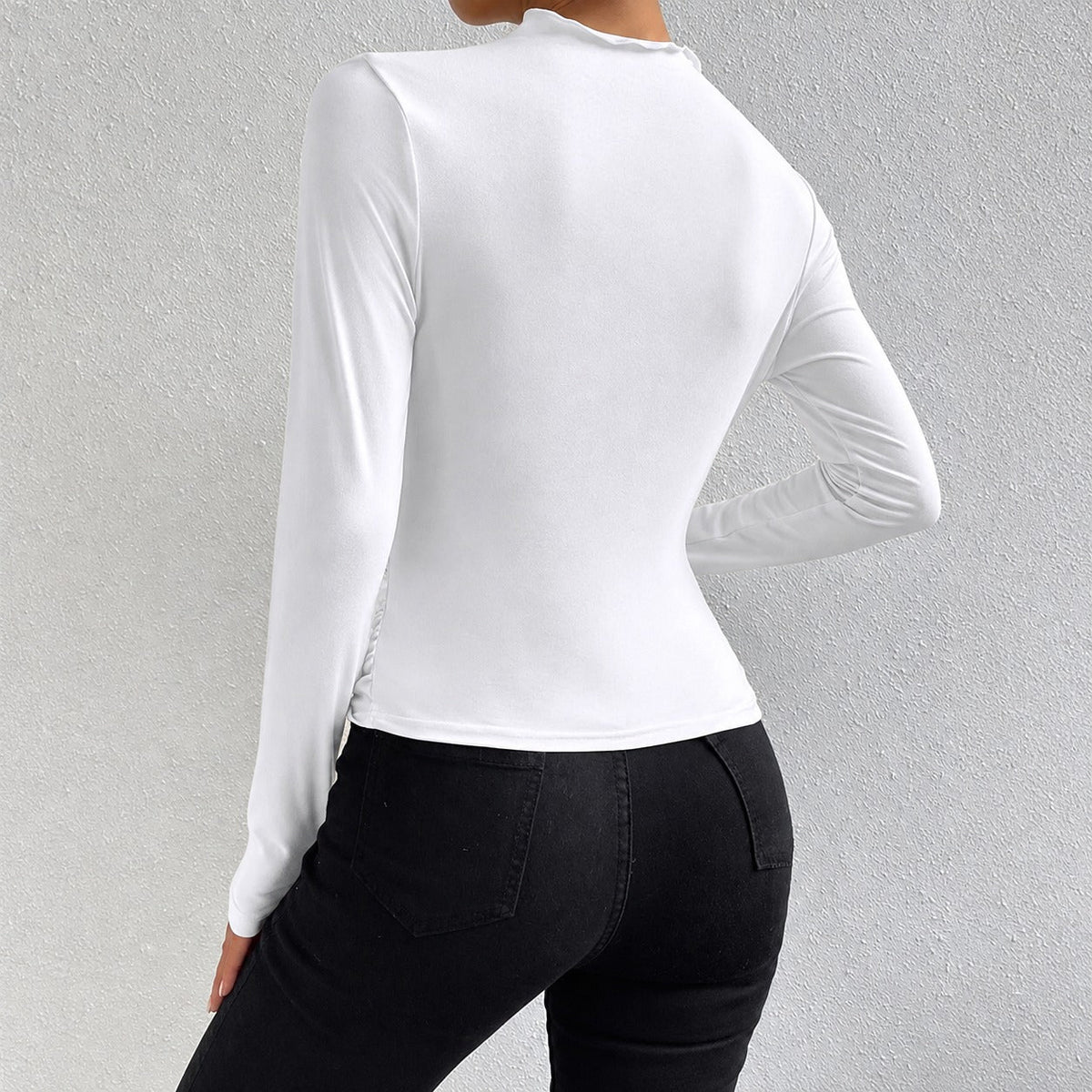 Livia - Camiseta de manga longa ajustada com babados