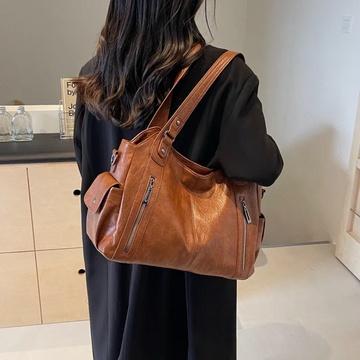 Bolsa de ombro feminina com múltiplos compartimentos e design elegante