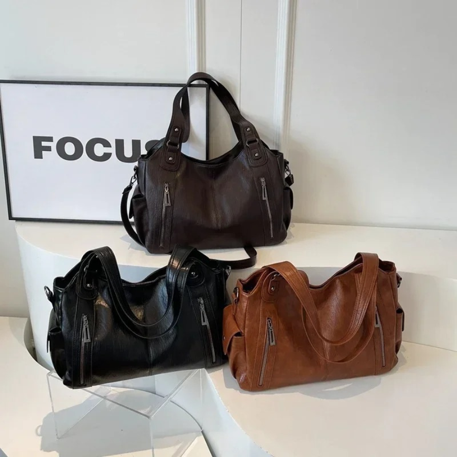 Bolsa de ombro feminina com múltiplos compartimentos e design elegante