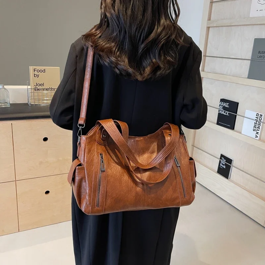 Bolsa de ombro feminina com múltiplos compartimentos e design elegante