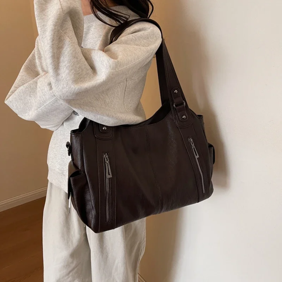 Bolsa de ombro feminina com múltiplos compartimentos e design elegante