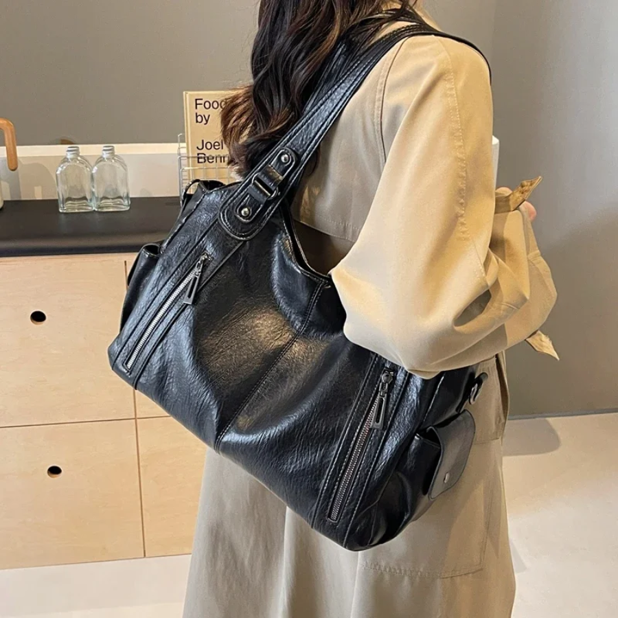 Bolsa de ombro feminina com múltiplos compartimentos e design elegante