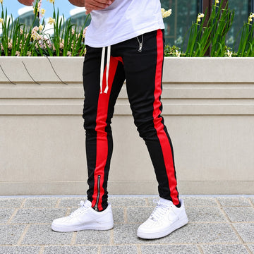Calças jogger masculinas com listras contrastantes e bolsos com zíper