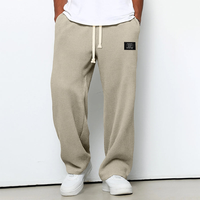 Calças jogger masculinas com textura em waffle e cós com cordão - corte reto