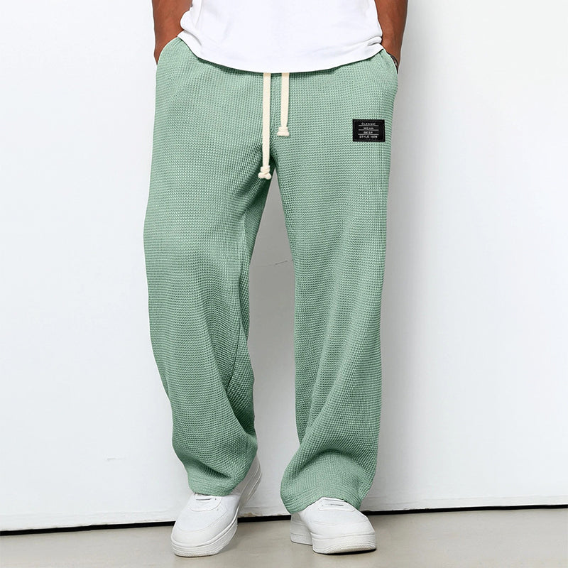 Calças jogger masculinas com textura em waffle e cós com cordão - corte reto