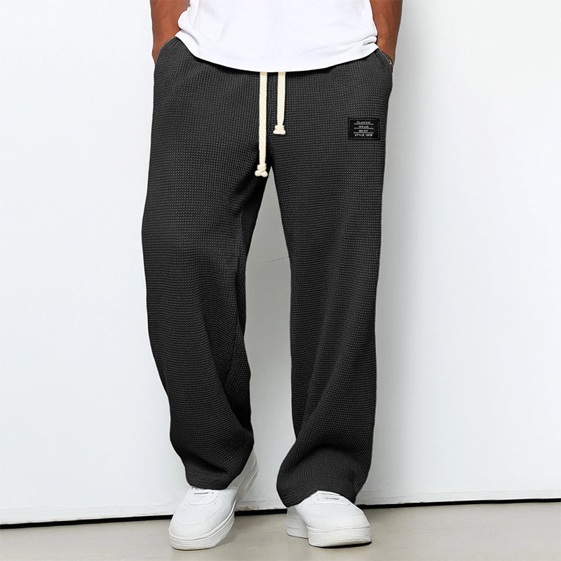 Calças jogger masculinas com textura em waffle e cós com cordão - corte reto