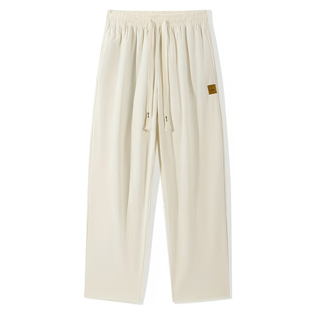 Calças masculinas com cordão e pala externa - corte reto relaxado, textura ribada, bolsos laterais e traseiro