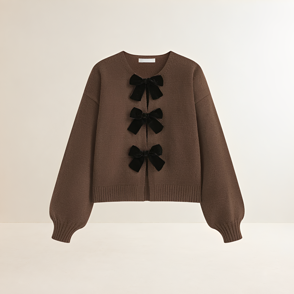 Cardigan feminino com mangas lanternas detalhes laço decote V cropped
