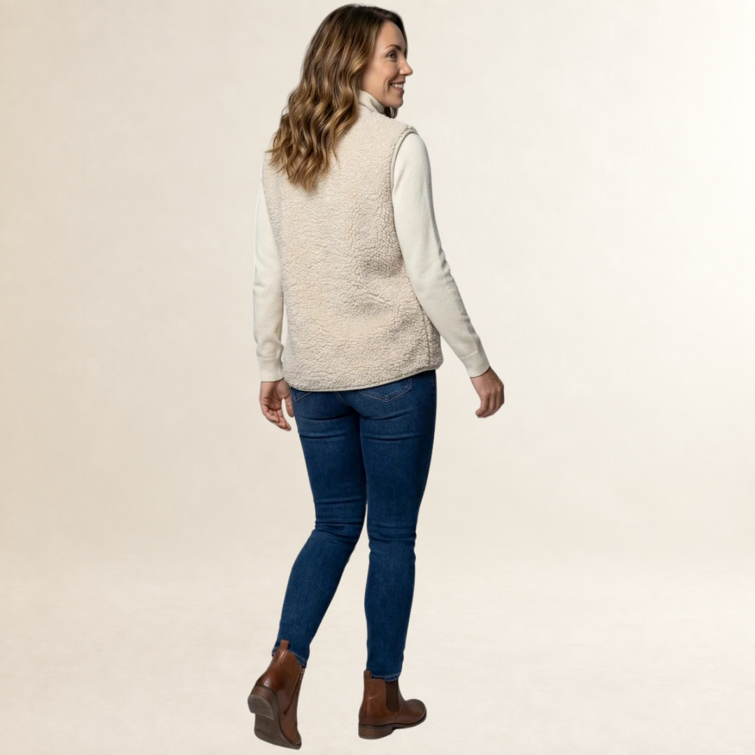 Colete feminino sem mangas com fechamento em botões e bolsos frontais - corte reto relaxado
