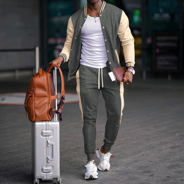 Conjunto esportivo masculino com jaqueta varsity color block e calças jogger