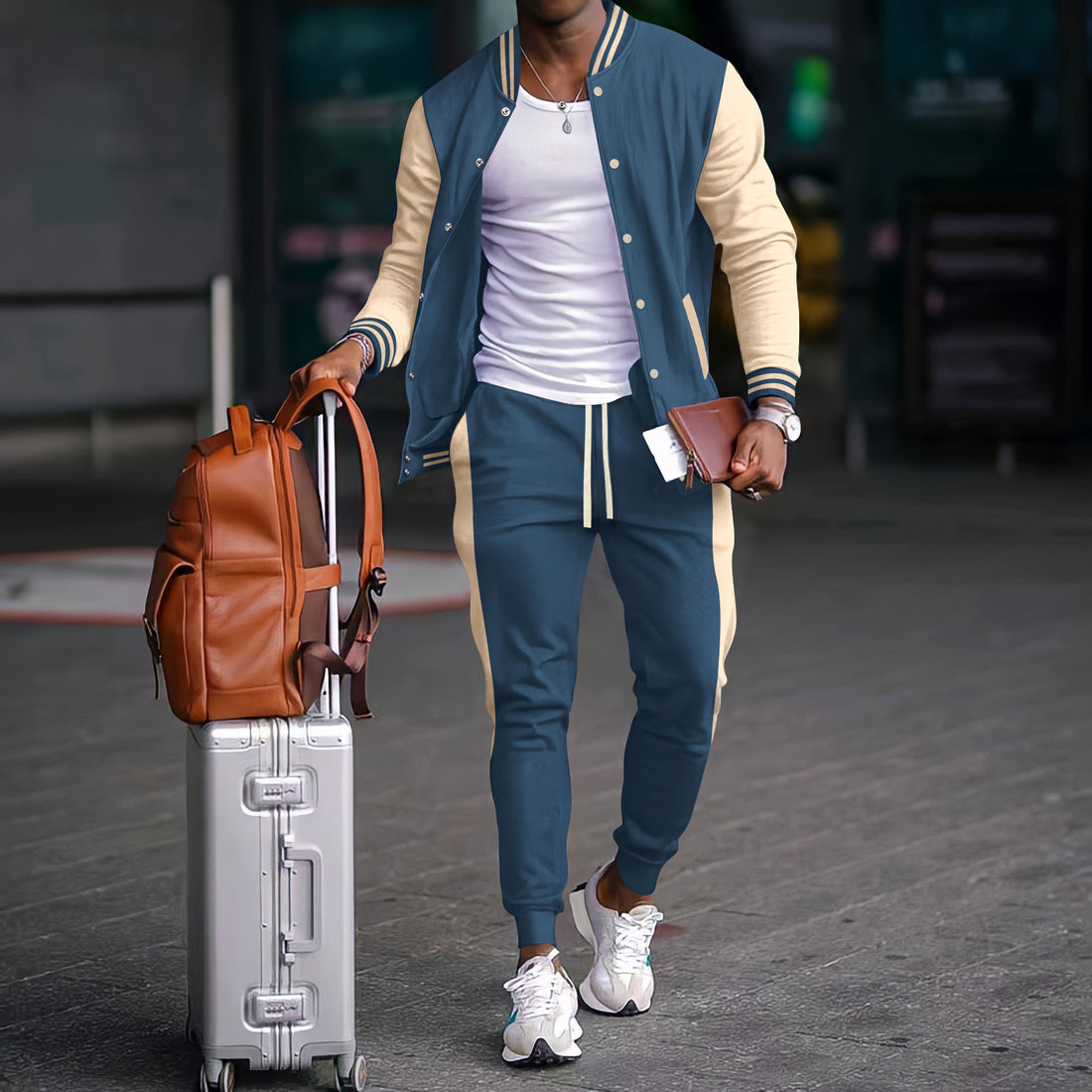 Conjunto esportivo masculino com jaqueta varsity color block e calças jogger
