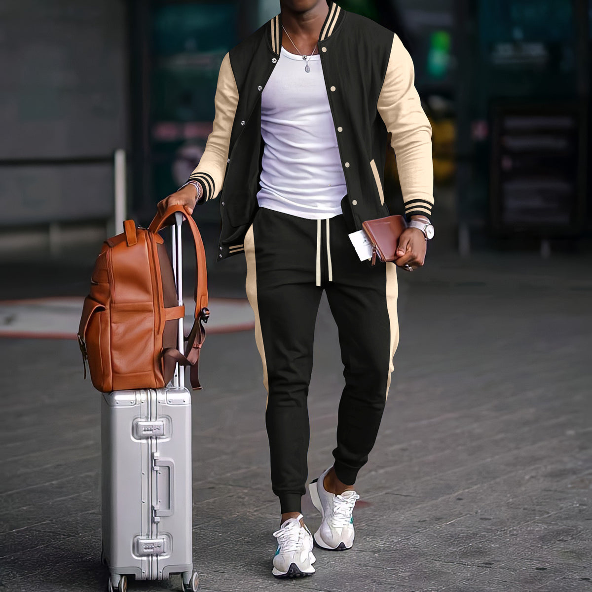 Conjunto esportivo masculino com jaqueta varsity color block e calças jogger