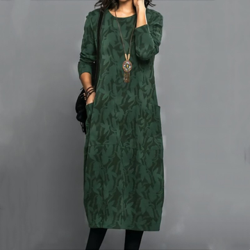 Vestido curto midi feminino com decote redondo, mangas longas, bolso lateral e estampa sutil de folhas