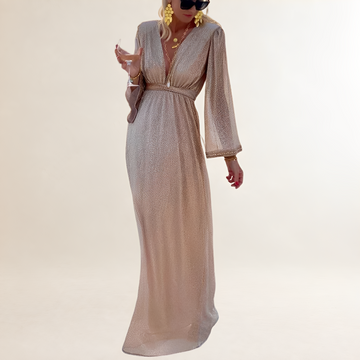 Vestido longo feminino com decote em V profundo, mangas sino e cintura império com brilho sutil