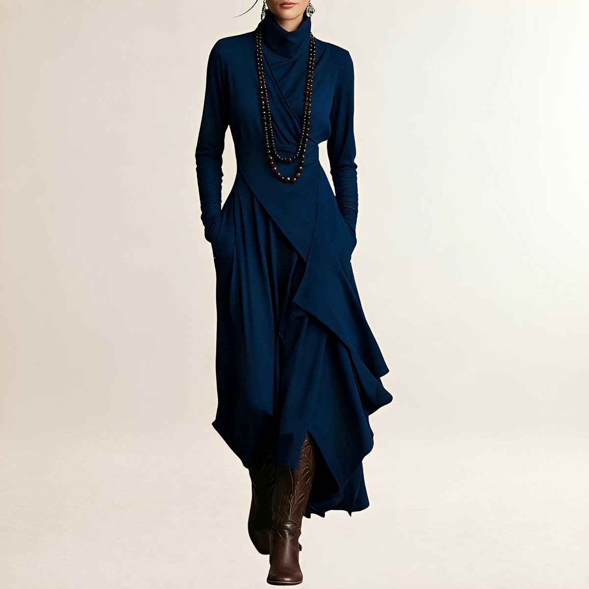 Vestido maxi feminino com gola alta, corpo drapeado cruzado, manga longa, barra assimétrica com camadas e bolsos laterais