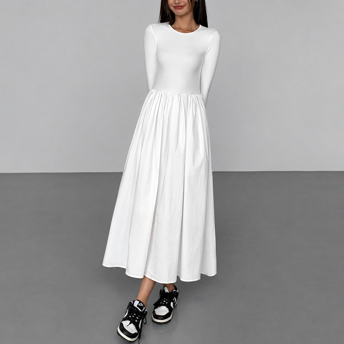 Vestido maxi feminino manga longa com decote redondo, bolsos e caimento regular