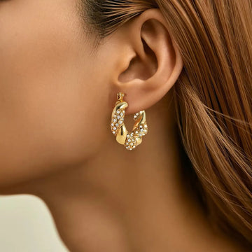 Alix – Boucles d'oreilles U-Twist em ouro