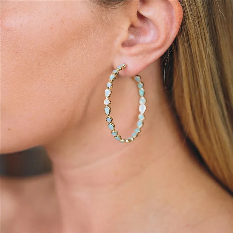 Raya – Brincos vintage dourados com opala azul